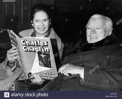 Download This Stock Image Charlie Chaplin And His Wife Oona At A Book