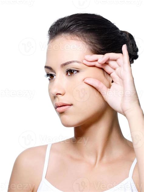 Woman Pinching Skin Near Her Eye 910078 Stock Photo At Vecteezy