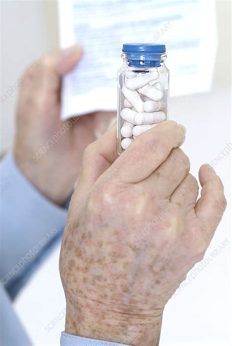 Elderly Person Taking Medication Stock Image C0020712