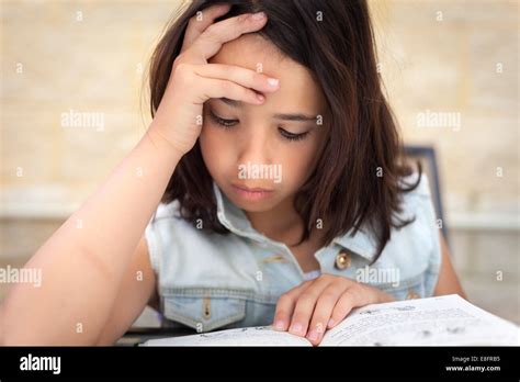Close Up Portrait Of A Girl Reading Book Stock Photo Alamy