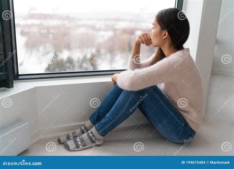 Depressed Young Girl Feeling Sad An Lonely Anxious Looking Out The Window In Winter Unhappy