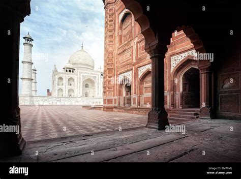 Taj Mahal Tomb And Mosque In The Arch At Blue Sky In Agra Uttar