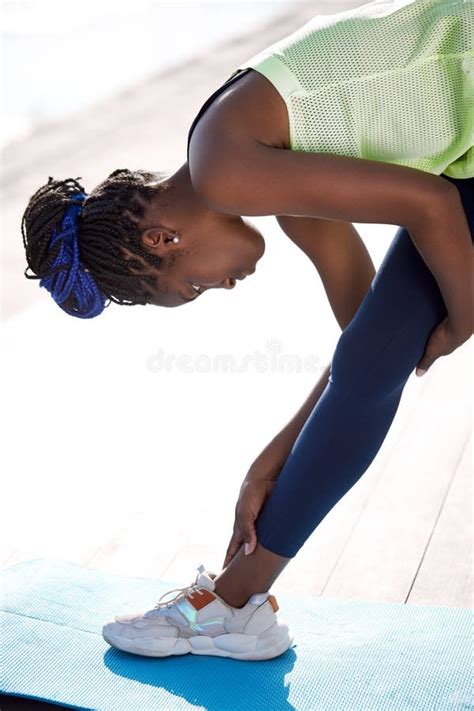 Athlete Afro Woman Stretching Hamstring Leg Muscles During Outdoor Running Workout Stock Image
