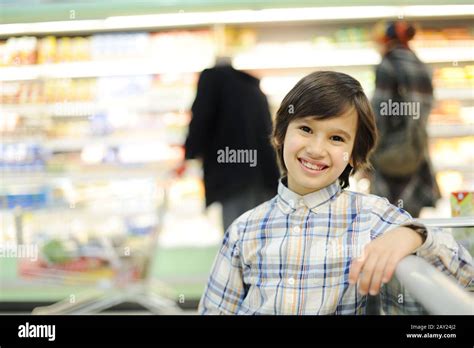 Boy In Supermarket Stock Photo Alamy
