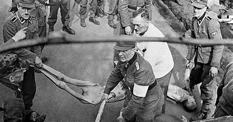 German Ss Troops Load Victims Of Bergen Belsen Concentration Camp Into