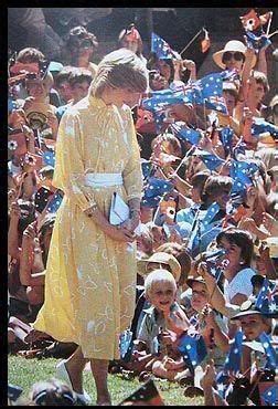 Diana wore a turquoise chiffon evening dress. March 21, 1983: Princess Diana among crowds of children ...