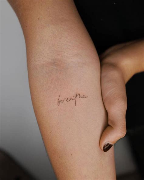 Breathe Lettering Tattoo On The Inner Forearm