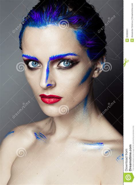Creative Art Makeup Of A Young Girl With Blue Eyes Stock
