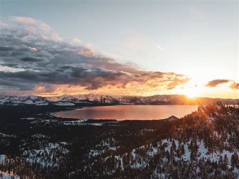 Aerial View Of The Beautiful Lake Tahoe Captured On A Snowy Sunset In