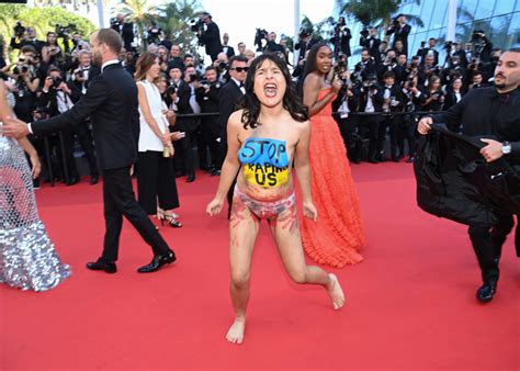 Naked Women Protests George Miller Red Carpet At Cannes