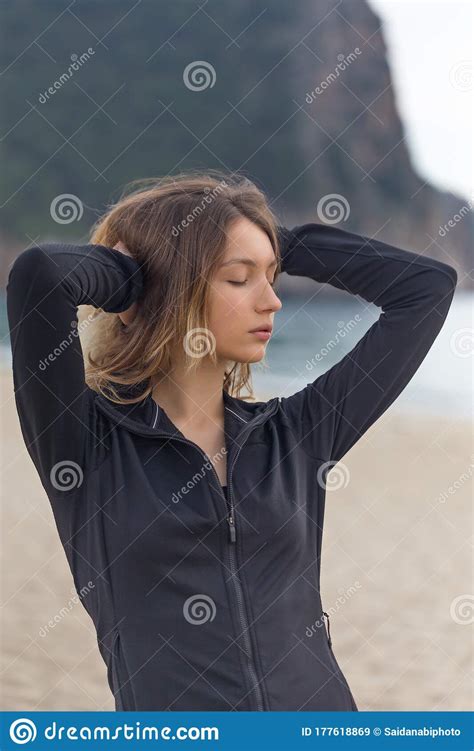 Fitnes And Wellness Concept Portrait Of Fit Female At The Beach Stock