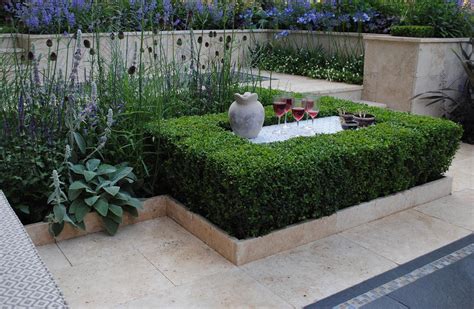 The goal of this landscape design and build project was to create a simple patio using peastone with a granite cobble edging. Small Garden Designs Surrey | Concepts Planting ...
