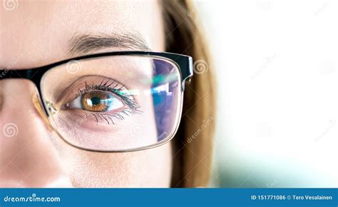 Close Up Of Eye And Woman Wearing Glasses Optometry Myopia Or Laser Surgery Concept Brown