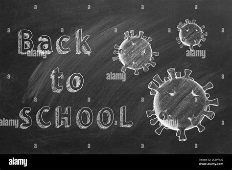 Hand Drawing Text Back To School On Blackboard Covid 19 Concept