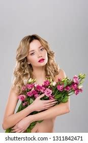 Surprised Naked Woman Holding Bouquet Eustoma Stock Photo
