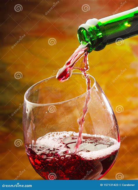 Red Wine Being Poured Into Wine Glass Stock Image Image Of Dinner