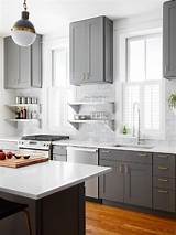 It's a versatile neutral that works well when paired with bold colors. Gray Shaker KItchen Cabinets with Engineered White Quartz ...