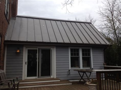 What are some of the most reviewed products in metal roofing? images of houses of metal roofs | Charcoal gray metal roof on one story Leska Addition in Silver ...