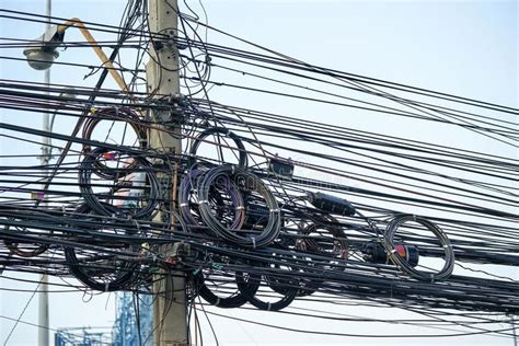 Messy Electrical Cables And Wires On Electric Pole Ad Cables