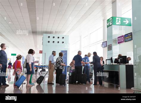 Passengers Queuing To Board At Airport Departure Gate Stock Photo Alamy