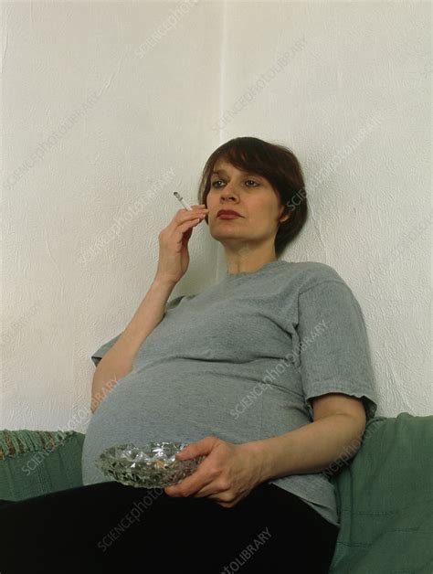 Pregnant Woman Smoking A Cigarette Indoors Stock Image M805 0425 Science Photo Library