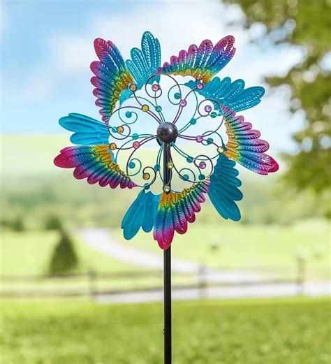 Simply Fabulous This Colorful Bird Wing Wind Spinner With Gems Is A