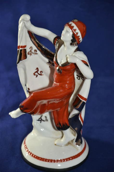 rare art deco figurine the base and the form of the woman are very classical but the playful