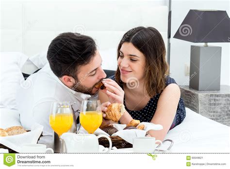 Honeymoon Couple Having Breakfast In Hotel Room Stock