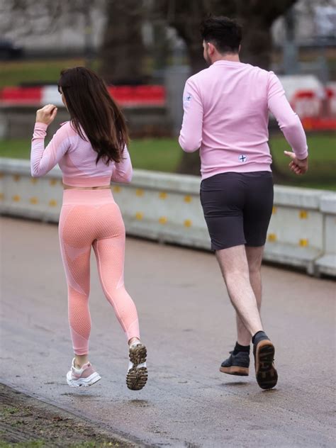 april banbury wearing tight lycra sportswear and crop top with scott mcglynn in london park 01