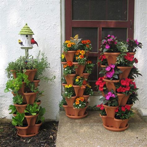 This diy garden tower planter (strawberry planter) will give you the extra gardening and planting space you need. Stackable Planter Pots Garden Outdoor Strawberry Herb ...