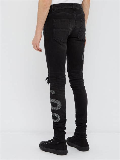 Amiri Denim Snake Embroidered Distressed Skinny Jeans In Black For Men