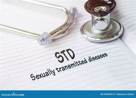 Std Sexually Transmitted Diseases Text On A Medical Card Next To A Pen Stethoscope Stock