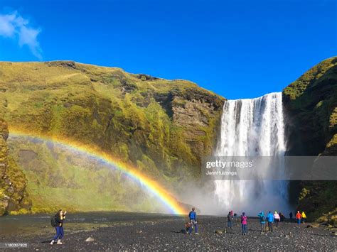 Skógar Iceland Skógafoss Waterfall With Rainbow And Tourist Crowd High