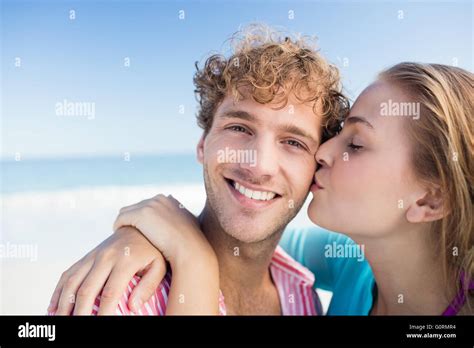 Happy Couple Embracing On The Beach Stock Photo Alamy