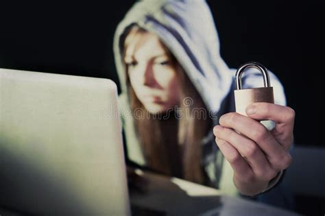 Young Attractive Teen Woman Wearing Hoodie Hacking Laptop Cybercrime