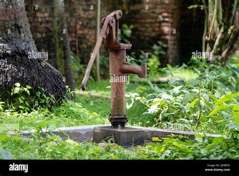 Hand Operated Water Pump Rusted And Forgotten Stock Photo Alamy