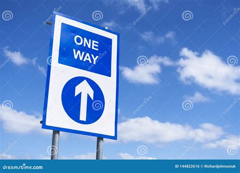 One Way Directional Arrow Sign Against Blue Sky Stock Photo Image Of
