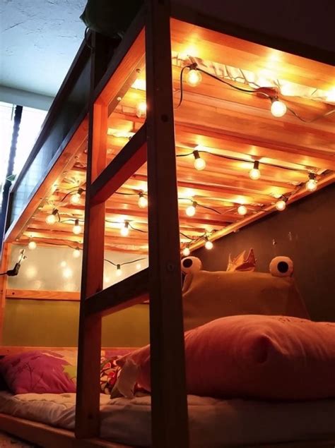 A Bunk Bed With Lots Of Lights On It