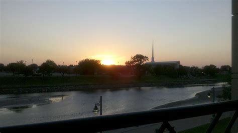 Sun Setting Over The Arkansas River In Downtown Wichita Kansas