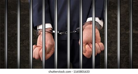 Handcuffed Man Behind Prison Bars Arrested Stock Photo Edit Now 789724897