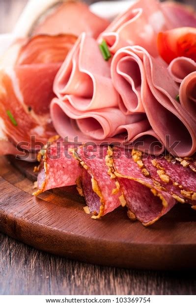 Sliced Cold Cuts On Wooden Chopping Stock Photo Edit Now 103369754
