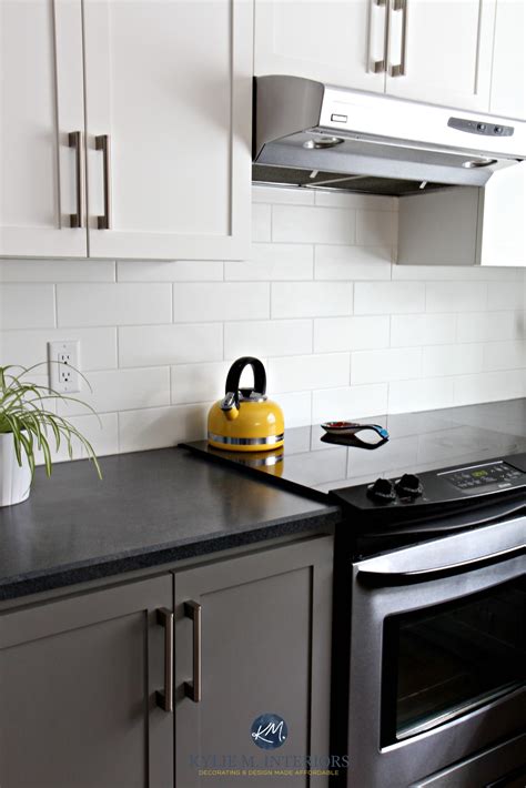 The backsplash used is a gray marbled tile pattern. Budget friendly kitchen with painted cabinets Benjamin ...