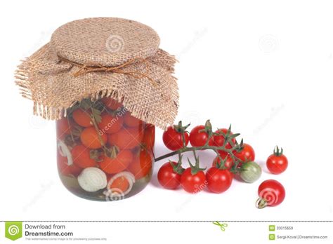 Canned Cherry Tomatoes In A Glass Jar And Fresh Tomatoes Stock Image