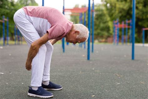 Grandfather Jogger Doing Stretching Outdoors Before Running In Summer Park Stock Image Image