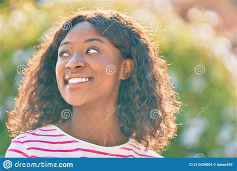 Young African American Girl Smiling Happy Standing At The Park Stock
