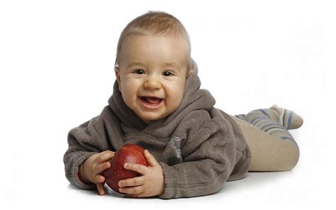 Baby Wearing Brown Hoodie While Holding Red Apple Hd Wallpaper