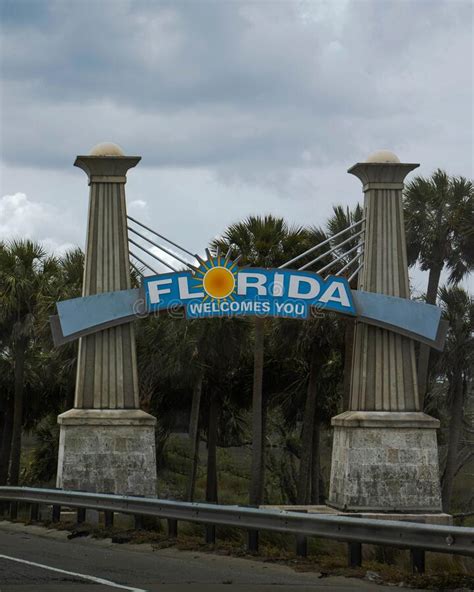 Vertical Shot Of The Welcome To Florida Sign On Tourist Attraction In