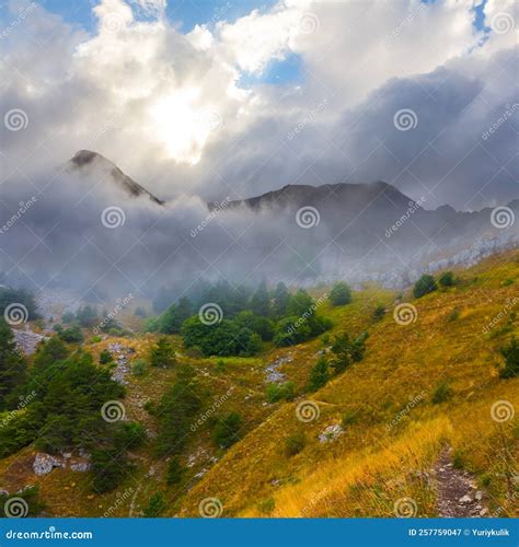Mountain Valley At In Dense Mist And Clouds Stock Image Image Of