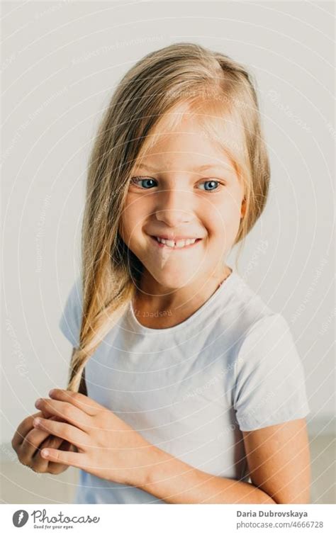 Sweet Girl 7 Years Old Blonde With Blue Eyes A Royalty Free Stock