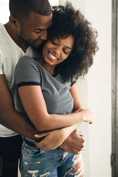 Young Black Couple Embracing At Home By Stocksy Contributor